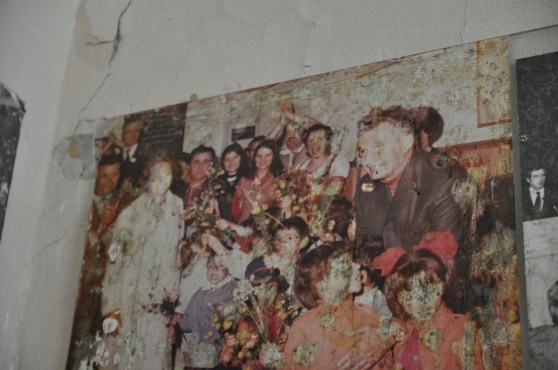 Damaged  old photo of Romanian dictator Nicolae Ceausescu on the wall of the revolution museum in Timisoara.